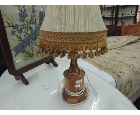 A marquetry style table lamp