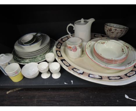 A shelf of 19th Century and later ceramics