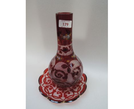 A Victorian style red glass decanter and similar plate 