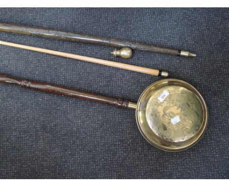 A metamorphic walking stick, snooker/ billiards cue and copper warming pan