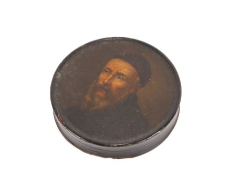 A 19th Century circular papier mache snuff&nbsp; box, the lid decorated with a bearded figure