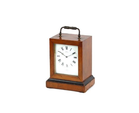 A mahogany cased carriage clock, with ebony banding and brass swing handle, the enamel dial inscribed "Exhibited by Crohe Hw,