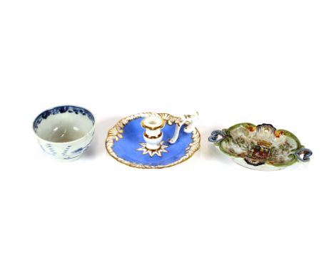 A Rockingham porcelain chamberstick, with gilt foliate decoration on a blue ground; a Chinese blue and white tea bowl and a f