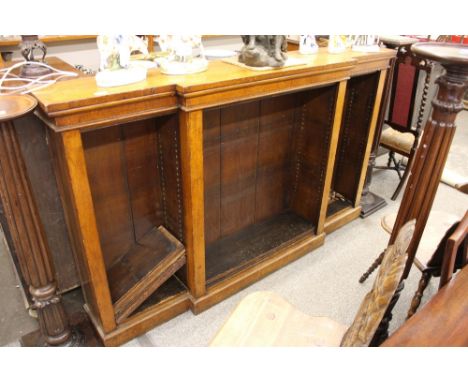 A Victorian light oak dwarf breakfront bookcase, fitted adjustable shelves and raised on a platform plinth, 183cm wide x 110c