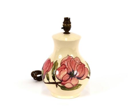 A Moorcroft pottery table lamp, Magnolia pattern, complete with shade