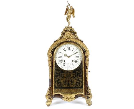 A 19th Century tortoiseshell and cut brass and ormolu inlaid French mantel clock, surmounted by a gilded winged messenger, ci