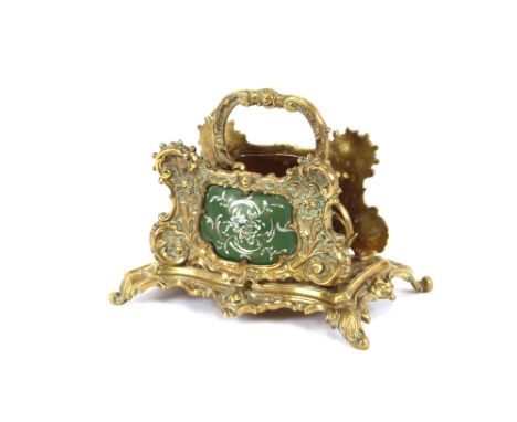 An early 20th Century ormolu letter rack,&nbsp;in the rococo taste, with two green enamel panels, 15cm high