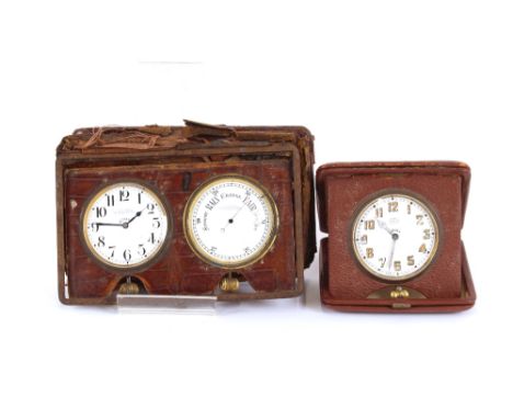 A crocodile skin cased travelling clock and barometer, by J.C. Vickery, Regent Street, AF; and a travelling watch by Asprey, 