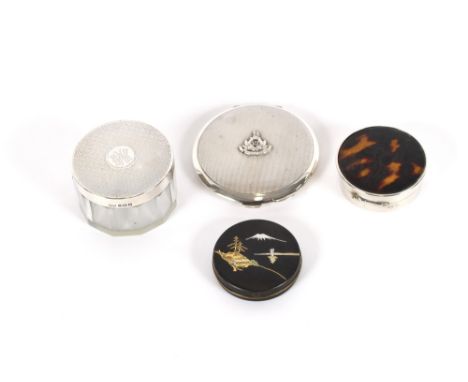 A circular silver compact, with engine turned decoration; circular glass and silver mounted tidy jar; and two faux tortoisesh