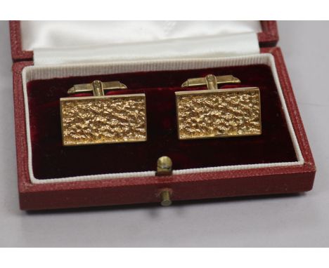 A pair of early 1970's textured 9ct gold rectangular cufflinks, in Asprey's box, 24mm.