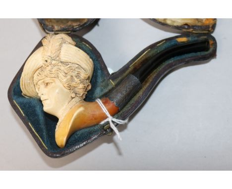 A cased meerschaum pipe