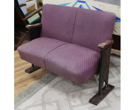 A 1920's cinema bench, with folding seat W.113cm