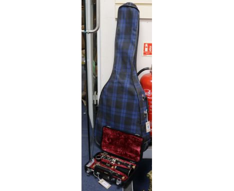 A Yamaha 26ii clarinet in fitted case and a BM Espana acoustic guitar