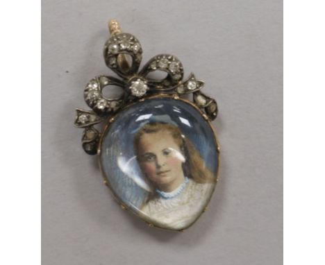An early 20th century yellow metal and diamond set pear shaped miniature portrait pendant, 35mm.