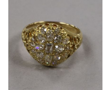 A Victorian style 18ct gold and old mine cut diamond set dress ring, size R.