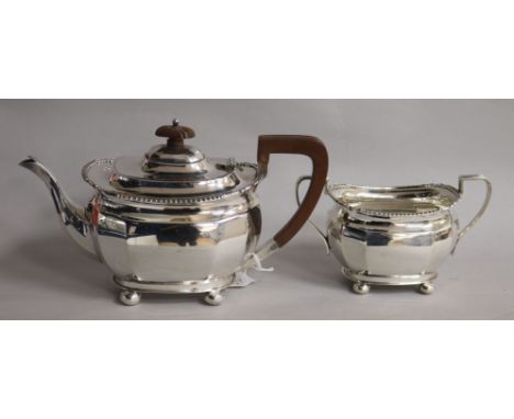 A silver two-piece tea service, comprising teapot and sucrier, of oval form, with gadroon rims and bun feet, Sheffield 1931, 