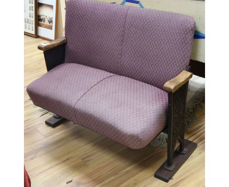 A 1920's cinema bench with folding seat W.110cm