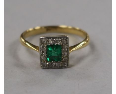 A 1930's/1940's 18ct gold, emerald and diamond cluster tablet ring, size M.