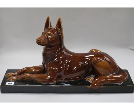 An Art Deco ceramic model of a dog width 52cm height 30cm