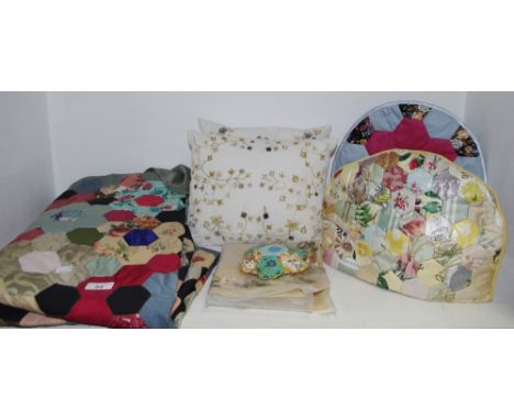 Textiles - a single patchwork bed spread, c.1940;  patchwork tea cosy, c.1940;  another;  two embroidered cushions;  etc 