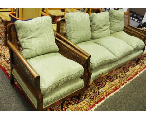 A bergere three seat sofa and conforming armchair (2)