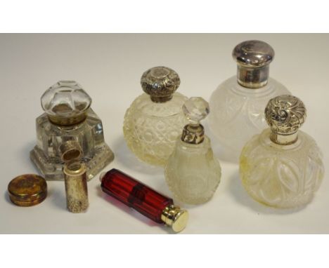 A late Victorian silver scent bottle chased and engraved with foliage, rubbed marks; a Victorian ruby glass double ended scen