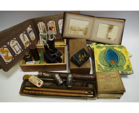 Boxes and Objects - a pocket telescope; a floating dairy thermometer; a microscope; tiles; a gun cleaner; a 19th century phot