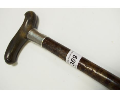 A silver topped walking stick 