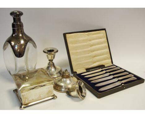 A Victorian silver square cigarette box, cedar wood lined, marks rubbed; silver candlestick, another (faults); a sterling sil