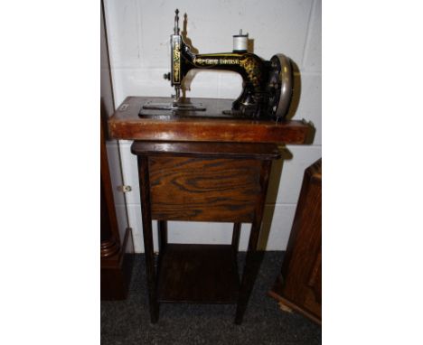 A universal manual sewing machine, a square work box on stand. (2). 
