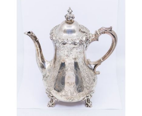 A Victorian silver coffee pot, baluster shaped body engraved with lambrequins, geometric decoration and vacant quatrefoil car