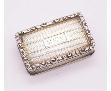 An early Victorian silver vinaigrette, engine turned body, the cover with rectangular cartouche engraved with initials MKW, r