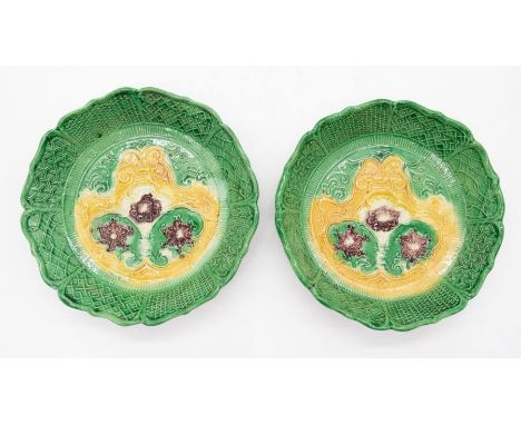 A pair of English 18th Century moulded pottery dessert dishes, circa 1750, decorated with florets, scrolls and trellis, 14cm 