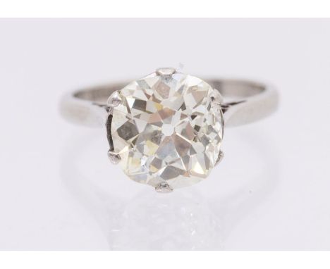 A diamond and platinum solitaire ring, comprising an old cushion cut diamond, weighing approx  2.77carats, assessed colour M/