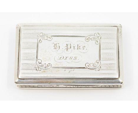 A Victorian silver compressed casket shaped snuff box, engine turned with Regency stripe decoration, the cover with framed ca