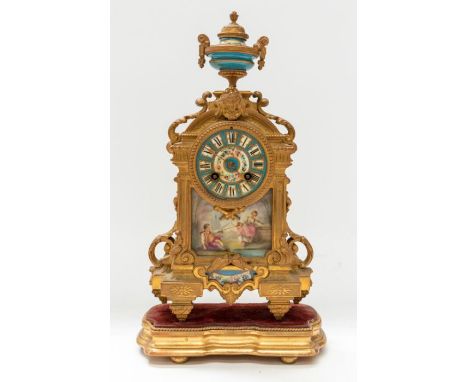 Swinden and Sons Paris 8 day French mantel clock and matching garnitures. 3" blue porcelain dial with Roman numerals and garl