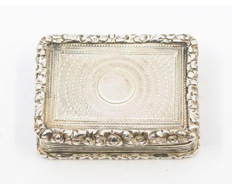 An early Victorian silver vinaigrette, with heavy chased ornate border, engraved circular radial decoration to recess, the pi