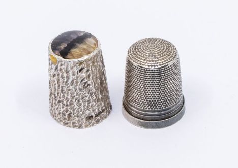 A Modern silver thimble, with textured body and blue john top insert, hallmarked probably by BJK., Sheffield, 1984 together w