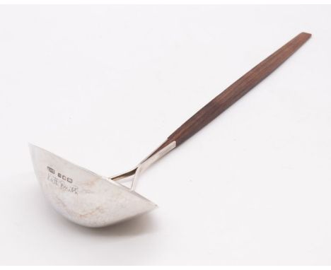 A Modernist silver shaped oval planished (hammered) ladle, with rosewood handle, hallmarked by Keith H Smith, London, 1971, w