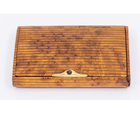 An early 20th Century French walnut cigarette case, comprising a ridged machine walnut form, hinged, the lid with an 18ct gol