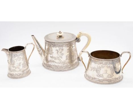 A Victorian matched three piece Aesthetic silver tea service to include teapot, sugar bowl and milk jug, each body engraved w