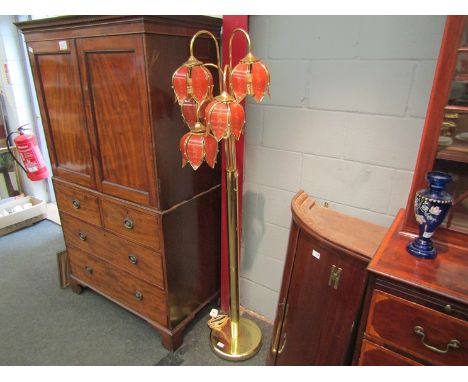 A brassed standard lamp with petal form shades 