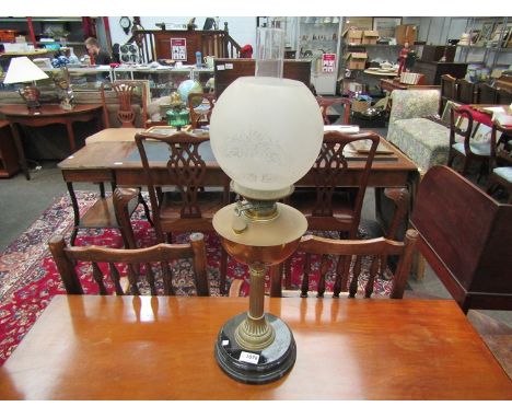 A brass oil lamp with etched floral shade   