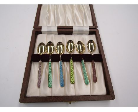 A cased set of silver gilt and enamel spoons by Th Marthinson
