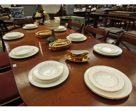 A quantity of Royal Worcester Gold Chantilly dinner wares with gilded tureens and gravy boat