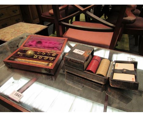 A Victorian sike's hydrometer, cased, together with a vintage playing card and counter set