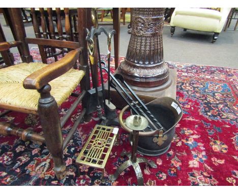 A copper coal scuttle and a selection of fire tools etc