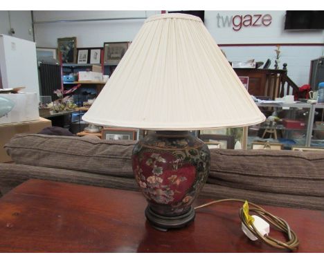 A Chinese style ceramic lamp base with cream pleated shade, 40cm tall
