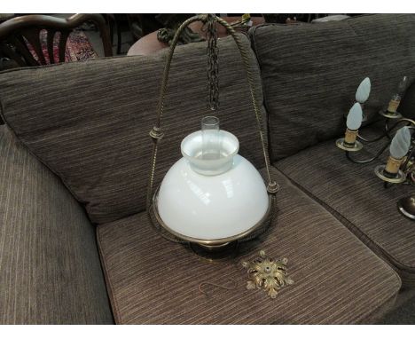 A Victorian brass ceiling hanging oil lamp with white glass shade and Veritas burner    