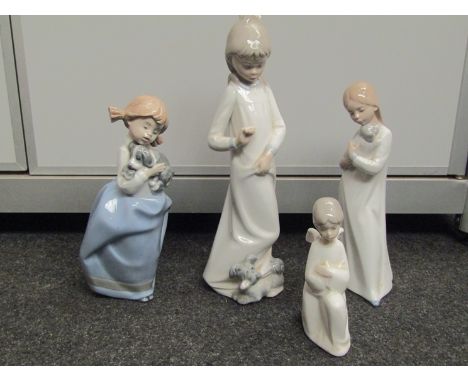 Four Nao figures of girls with puppies and angel